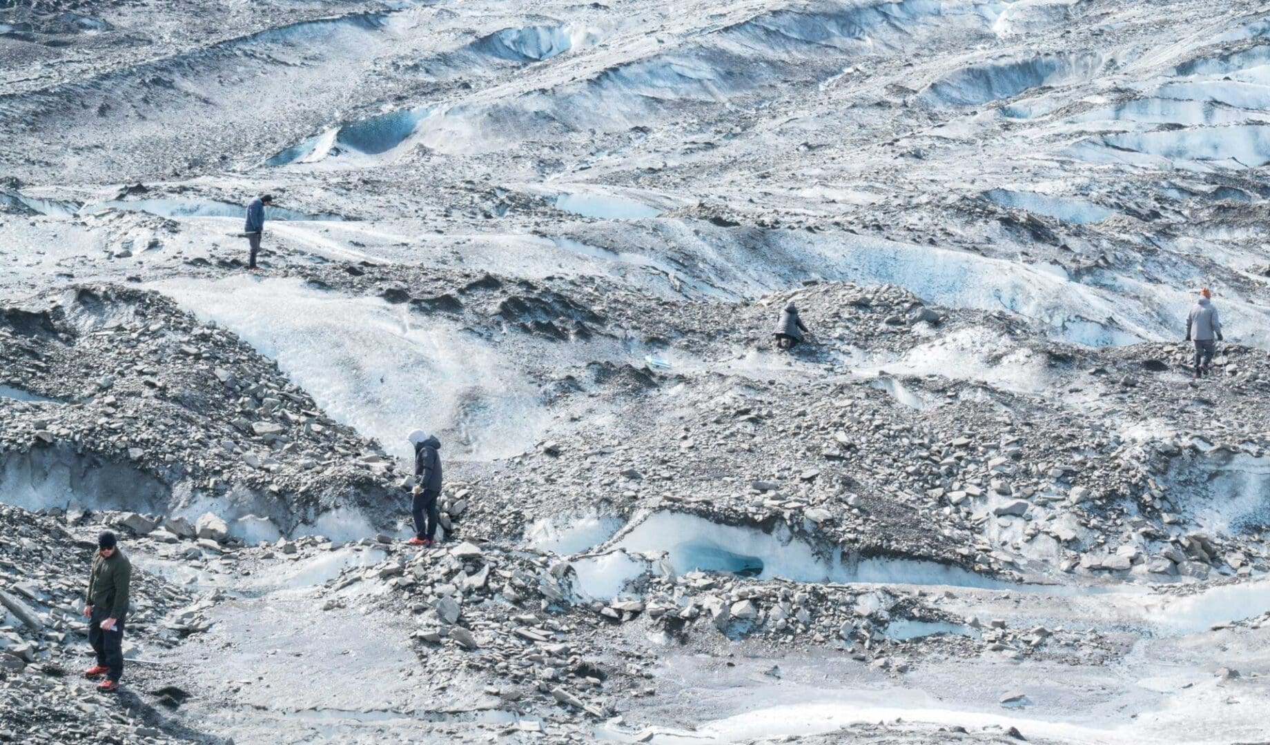 Members of the Operation Colony Glacier recovery team search for remains of fallen service members and wreckage from a C-124 aircraft that crash landed in November 1952 at Colony Glacier, AK, June 17, 2021. USAF photo by SSgt Johnathon Wines