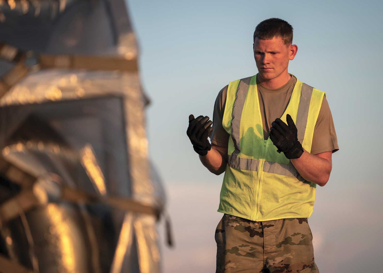 2Lt Jace Waters, 6th Logistics Readiness Squadron Air Transportation Officer in Charge, directs cargo movement during exercise Explode into Theater (EXPLODEO) 2024 at MacDill Air Force Base, FL, May 29, 2024. USAF photo by SrA Lauren Cobin