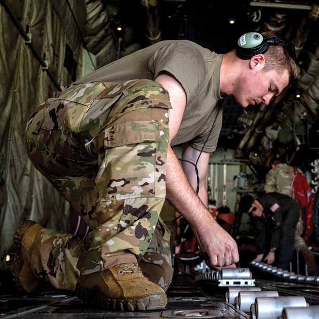 A1C Westin Means prepares a C-130J Super Hercules aircraft for cargo.