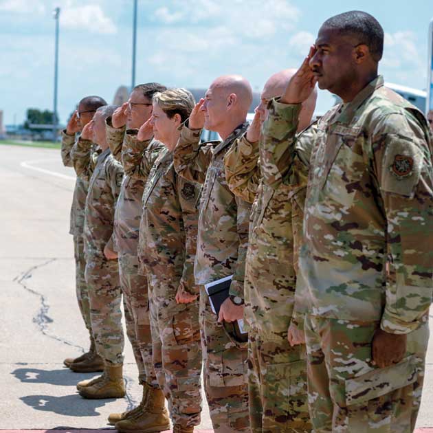 U.S. Transportation Command, Air Mobility Command, and Scott Air Force Base leadership salute Air Force leadership visiting Scott.