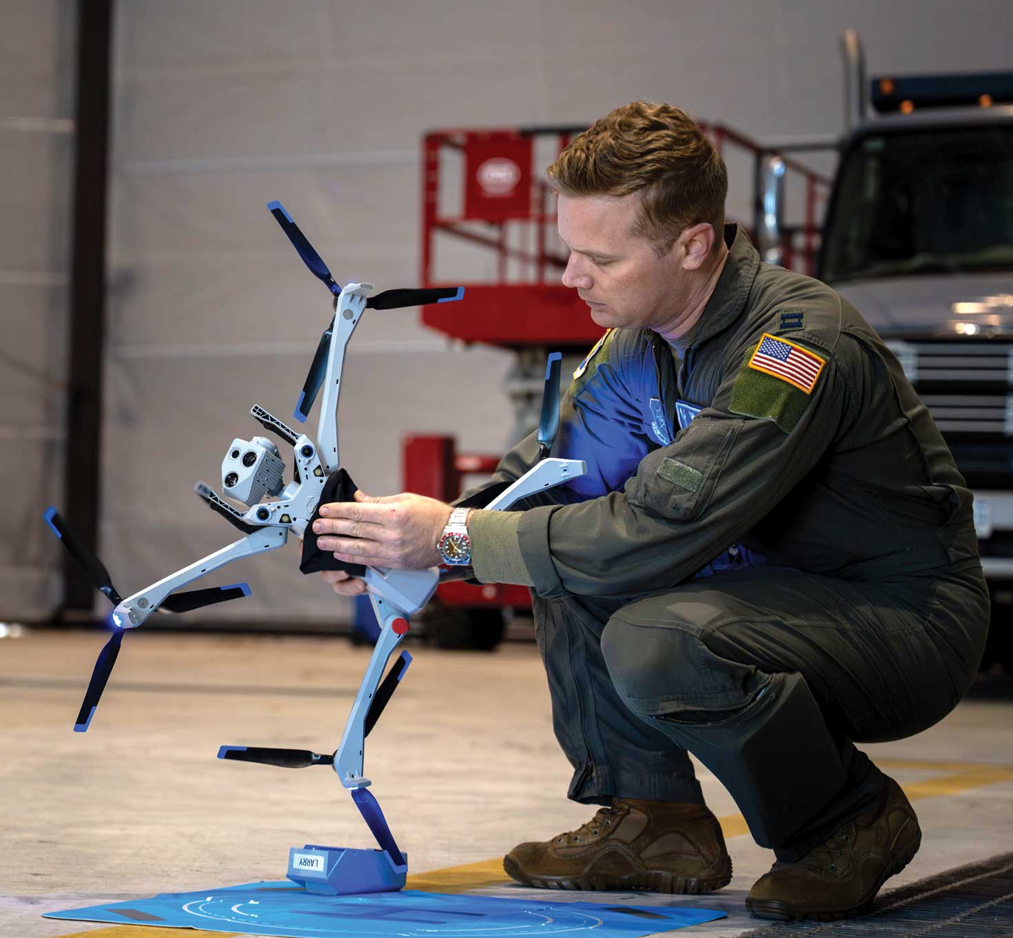 Capt Justin Lewis cleans a small unmanned aircraft system.