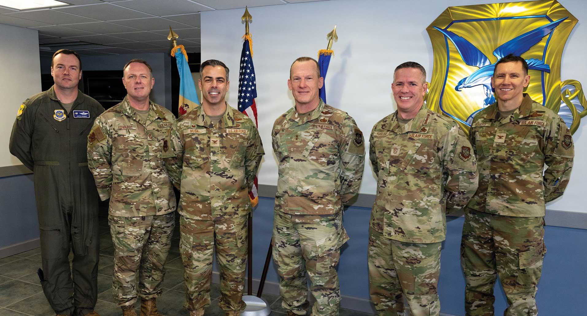 From left to right, Col Justin Longmire, 436th Airlift Wing (436 AW) Deputy Commander; CMSgt Elijah Edwards, 436 AW Command Chief; Col Jamil Musa, 436 AW Commander; Maj Gen Darren Cole, 21st Air Force and U.S. Expeditionary Center (21 AF and USAFEC) Commander; CMSgt Dennis Fuselier, 21 AF and USAFEC Command Chief; and Col Shane Rogers, 21 AF and USAFEC Deputy Commander.