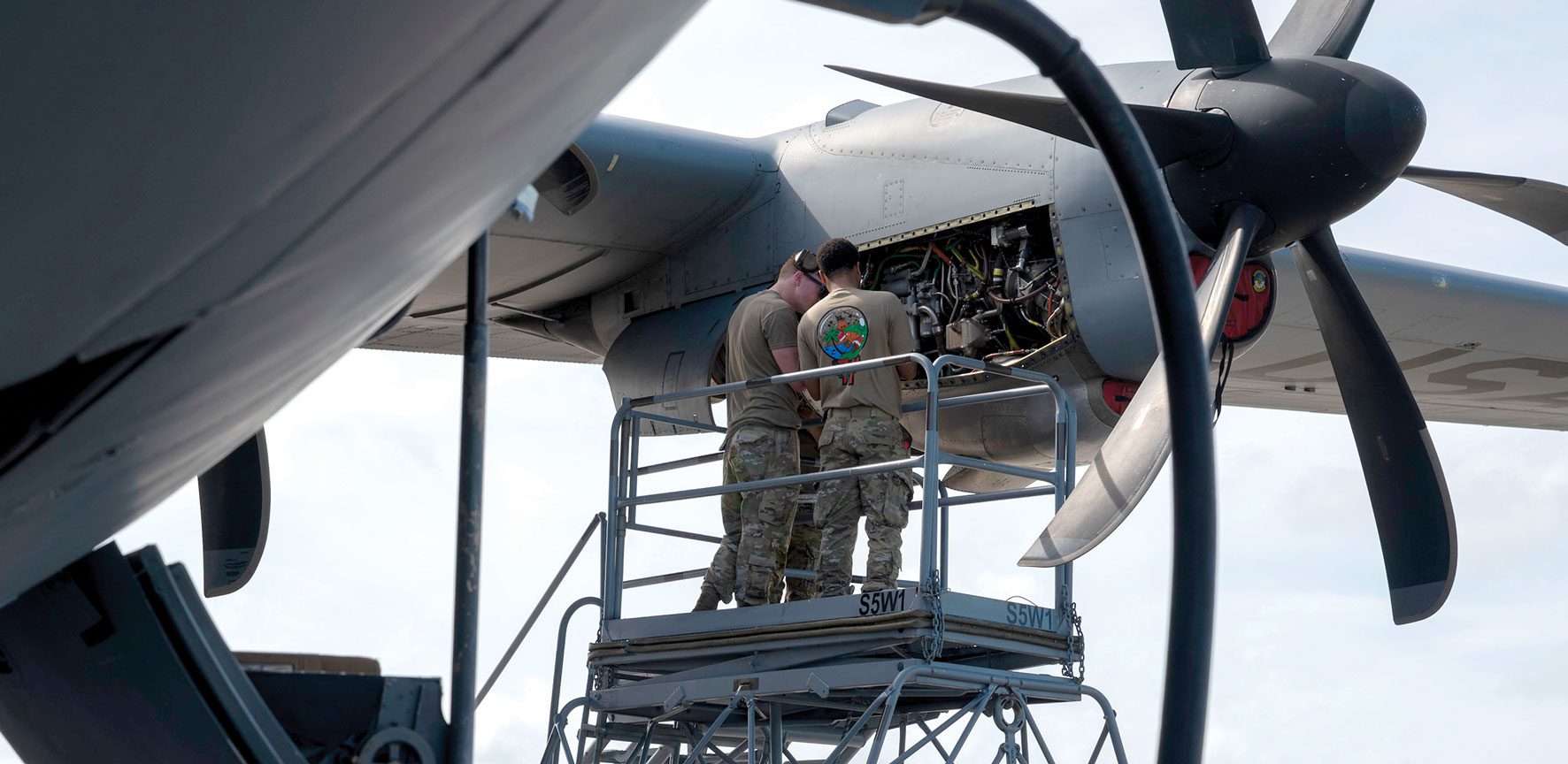 Airmen assigned to the 374 Air Expeditionary Wing, Yokota Air Base, Japan, conduct engine maintenance on a C-130J Super Hercules at Andersen Air Force Base, Guam.