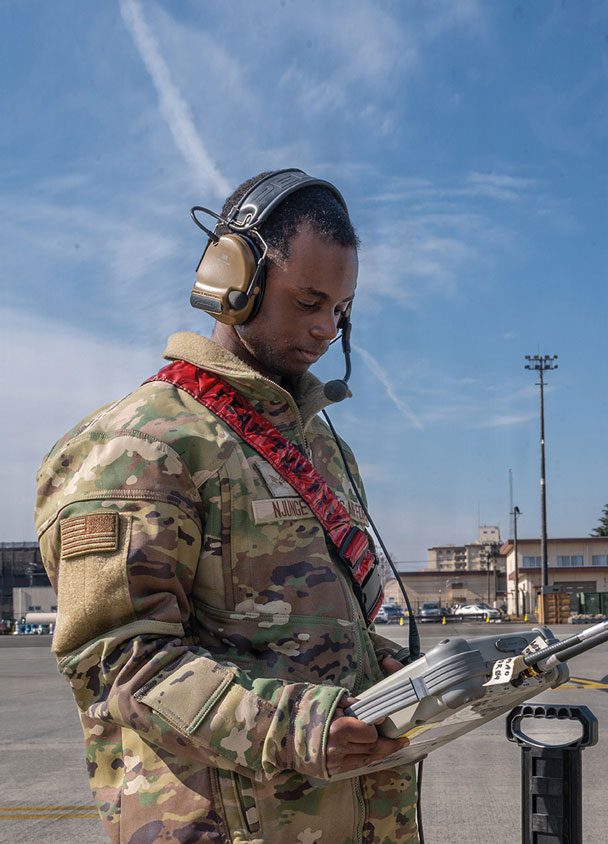 SrA Benjamin Spencer and SrA Gabriel Teska, 374th Maintenance Group, Yokota Air Base, Japan, troubleshoot the autopilot on a C-130J Super Hercules.