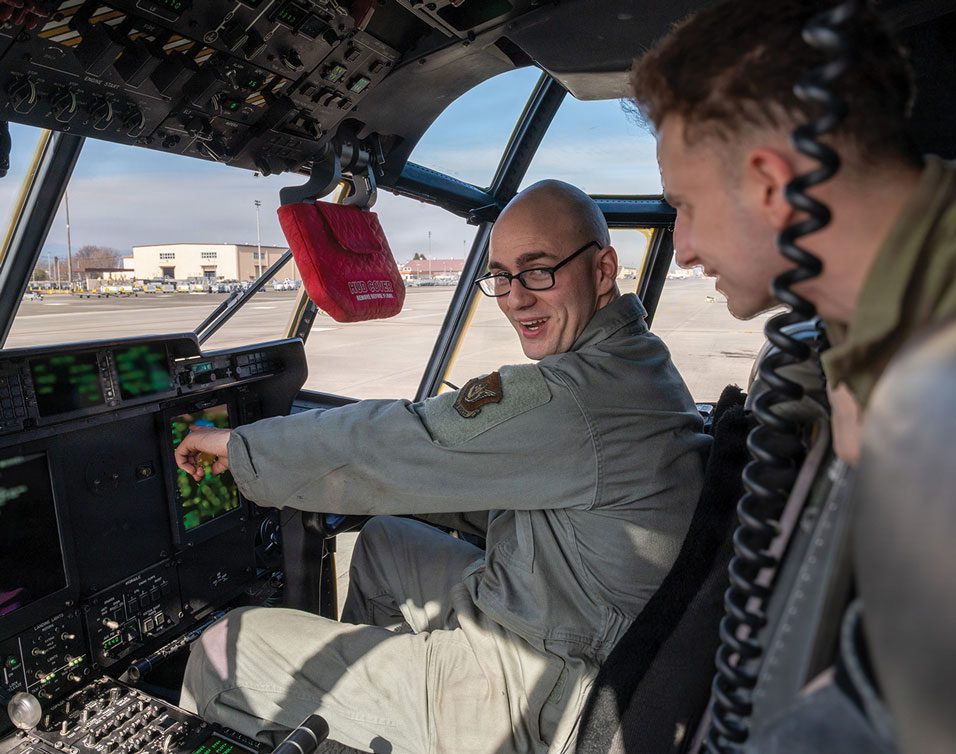 SrA Benjamin Spencer and SrA Gabriel Teska, 374th Maintenance Group, Yokota Air Base, Japan, troubleshoot the autopilot on a C-130J Super Hercules.